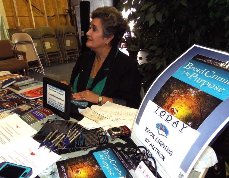 Author signs books